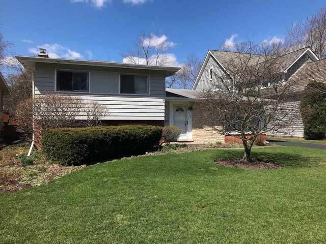 1218 Kenton Road Deerfield, IL 60015 - Photo 4 of 15 a front view of a house with garden
