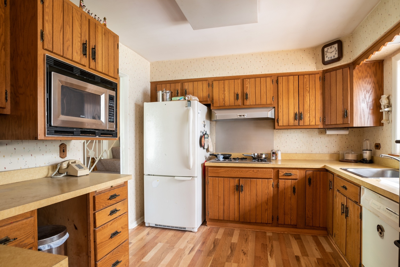 1218 Kenton Road Deerfield, IL 60015 - Photo 8 of 15 a kitchen with stainless steel appliances granite countertop a refrigerator a sink dishwasher a stove and a microwave oven with cabinets