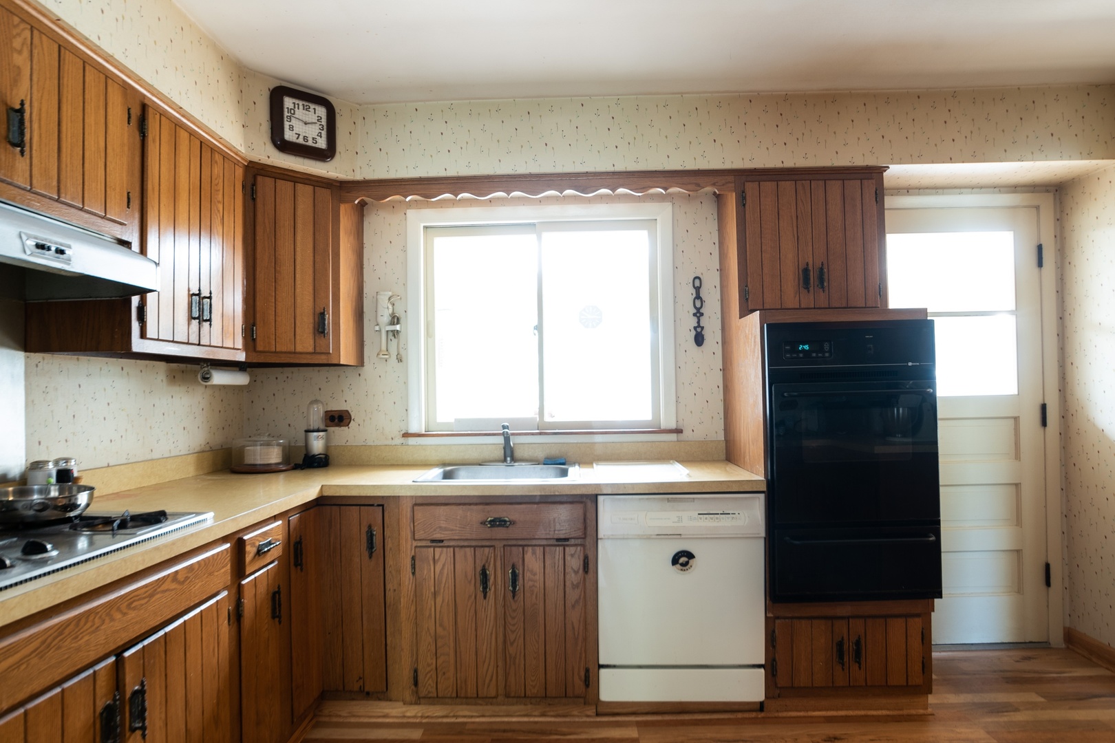 1218 Kenton Road Deerfield, IL 60015 - Photo 9 of 15 a kitchen with stainless steel appliances granite countertop a sink stove and refrigerator