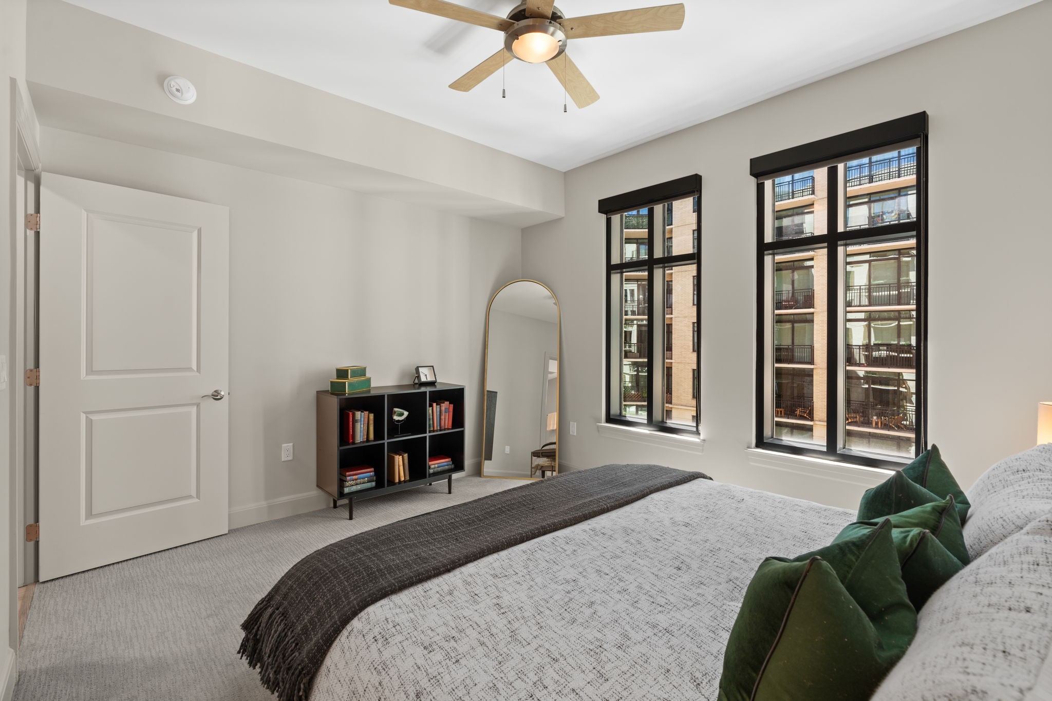 2511 Willowick Road, Unit 334 Houston, TX 77027 - Photo 13 of 39 a bedroom with a bed and a large window