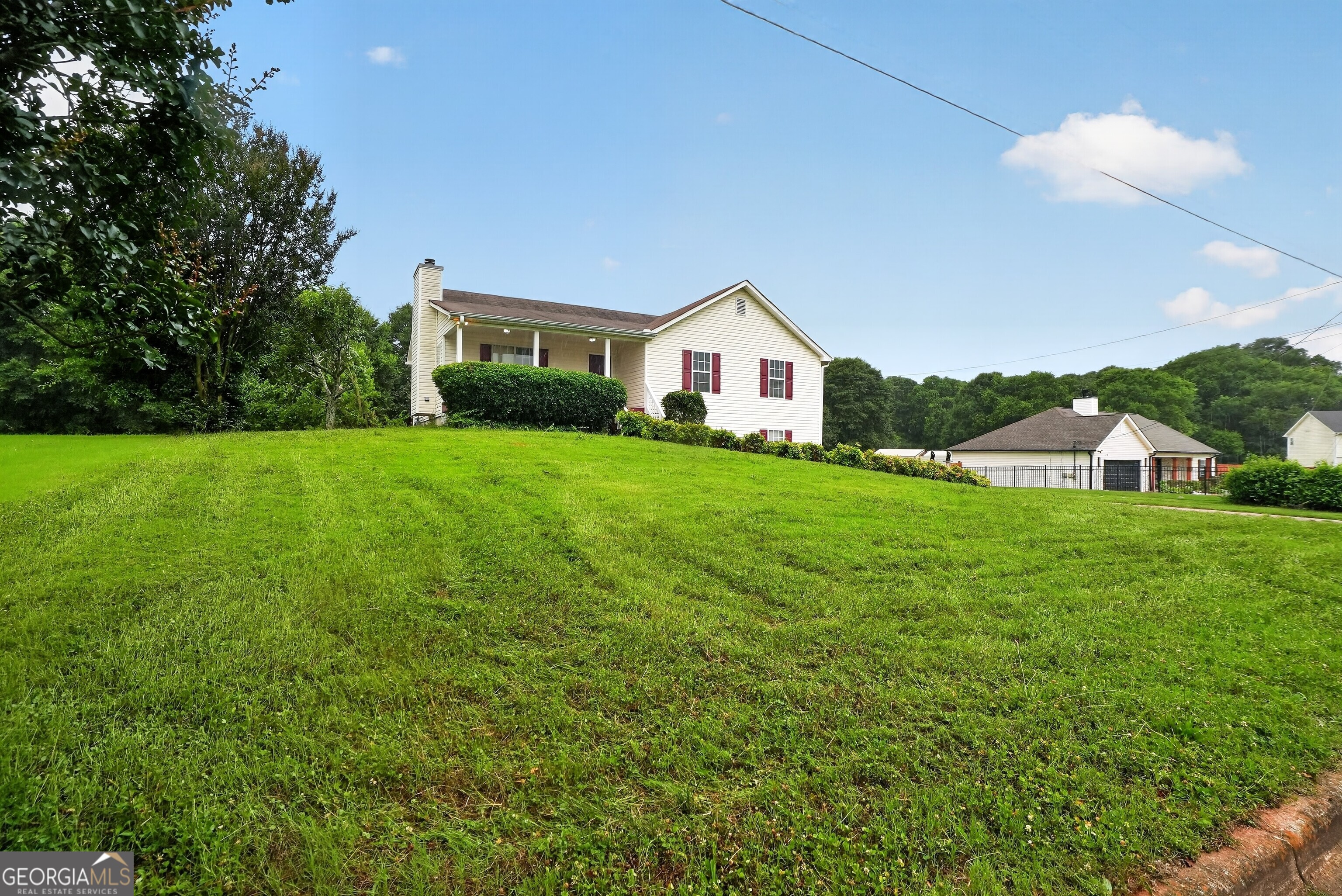 75 Linsley Way Covington, GA 30016 - Photo 4 of 48 a front view of a house with yard and green space