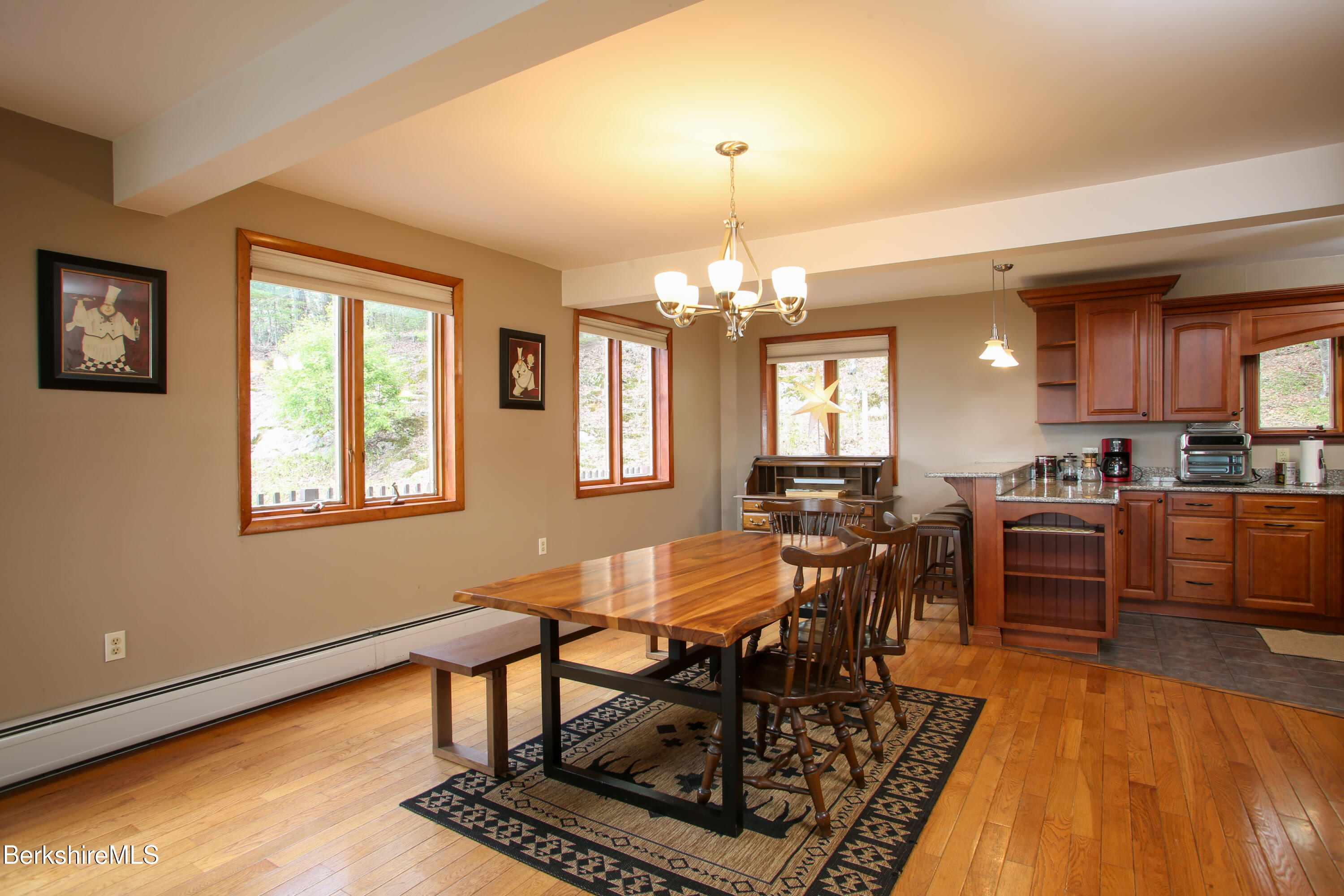 421 Legate Hill Road Charlemont, MA 01339 - Photo 8 of 37 a view of a dining room with furniture and chandelier