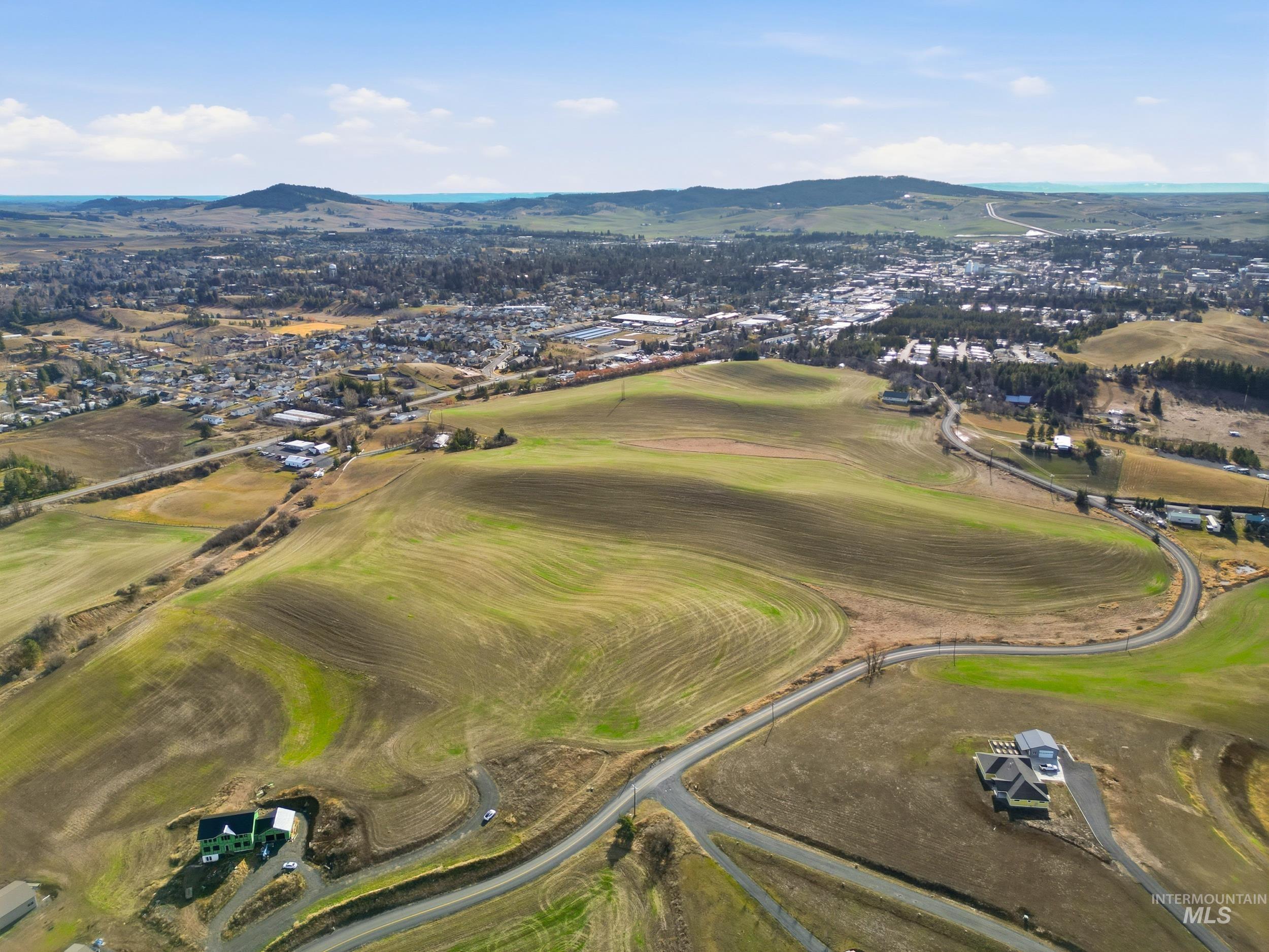Tbd Mix Road Moscow, ID 83843 - Photo 19 of 40 Aerial view of property and surrounding area with a mountain backdrop and a local golf course
