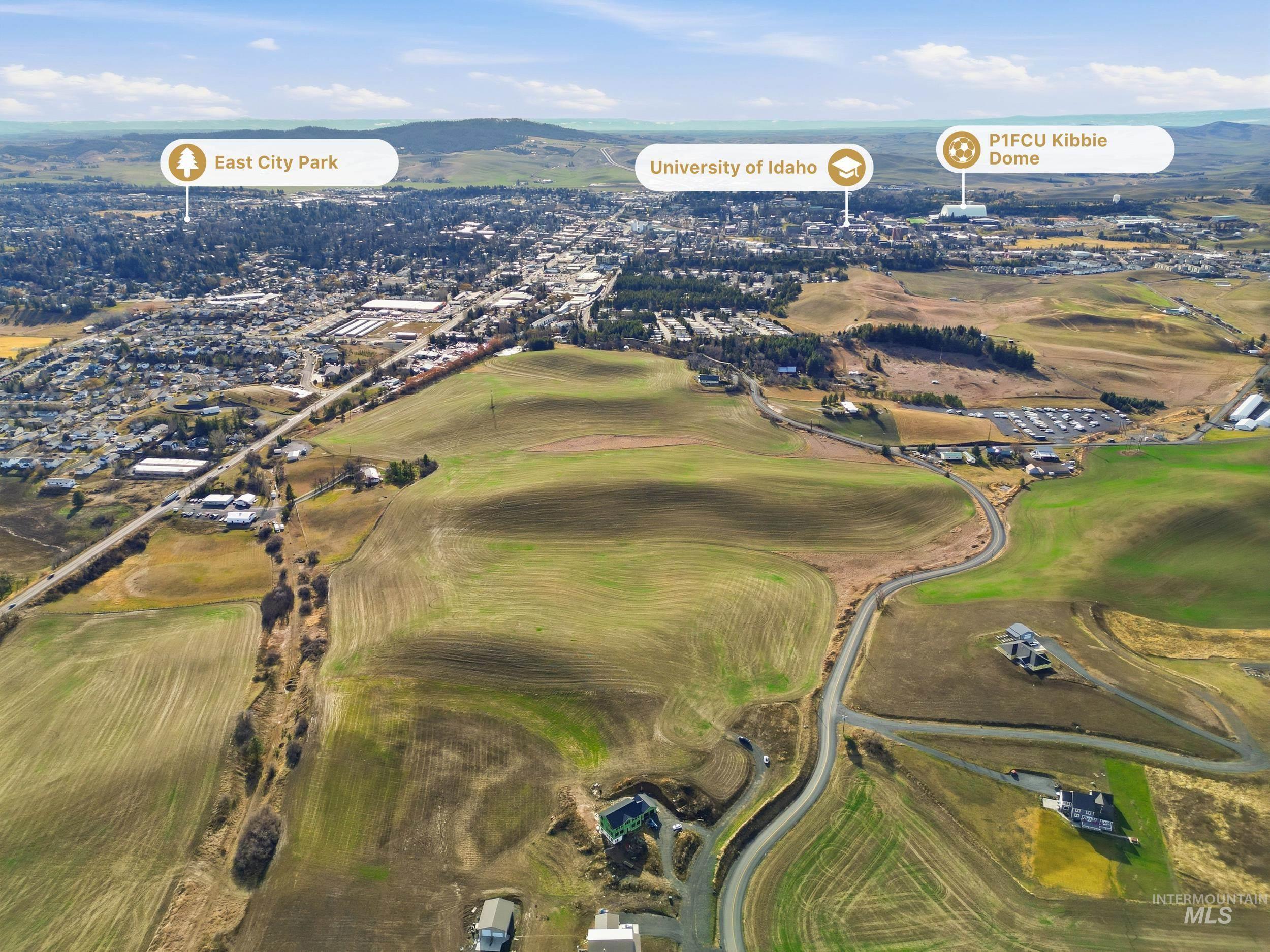 Tbd Mix Road Moscow, ID 83843 - Photo 4 of 40 Aerial view of property and surrounding area featuring a mountain backdrop and a local golf course