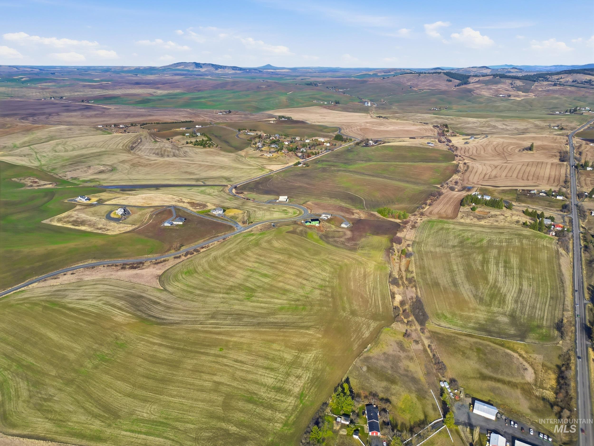Tbd Mix Road Moscow, ID 83843 - Photo 9 of 40 Aerial view of property and surrounding area with rural landscape and a mountain backdrop