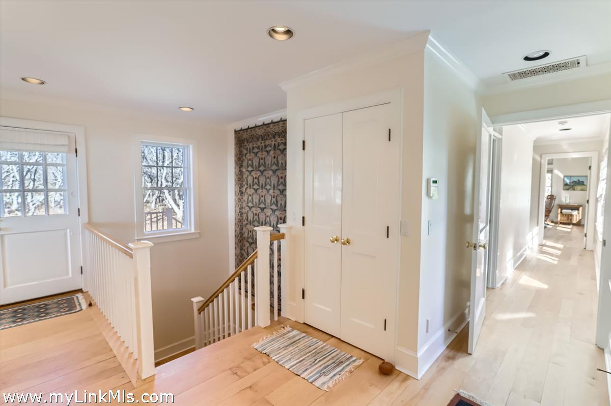 78 Hammett Road Chilmark, MA 02535 - Photo 34 of 53 a view of a hallway with bathroom and front door