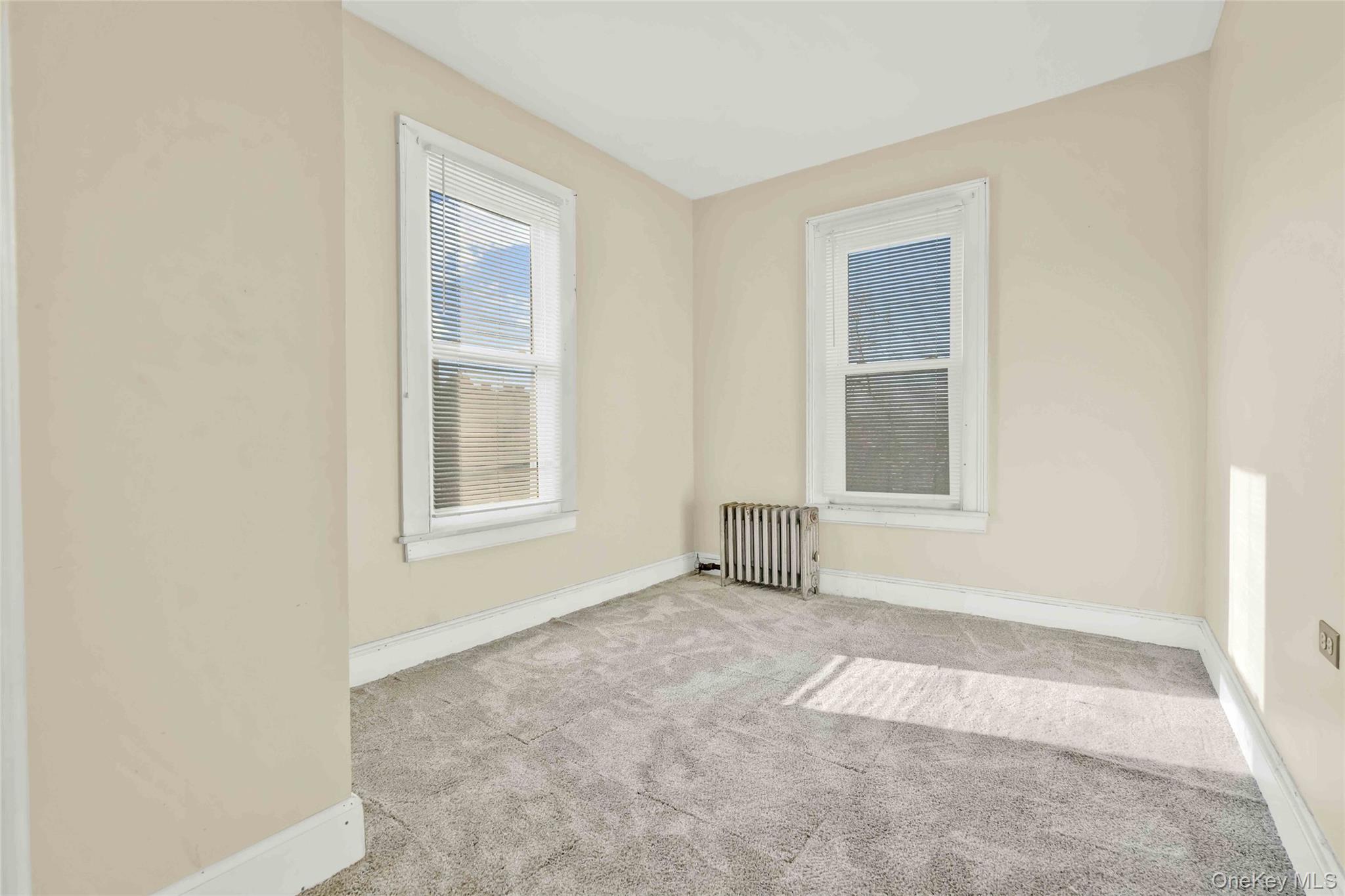 194 Crystal Street Brooklyn, NY 11208 - Photo 13 of 16 an empty room with windows