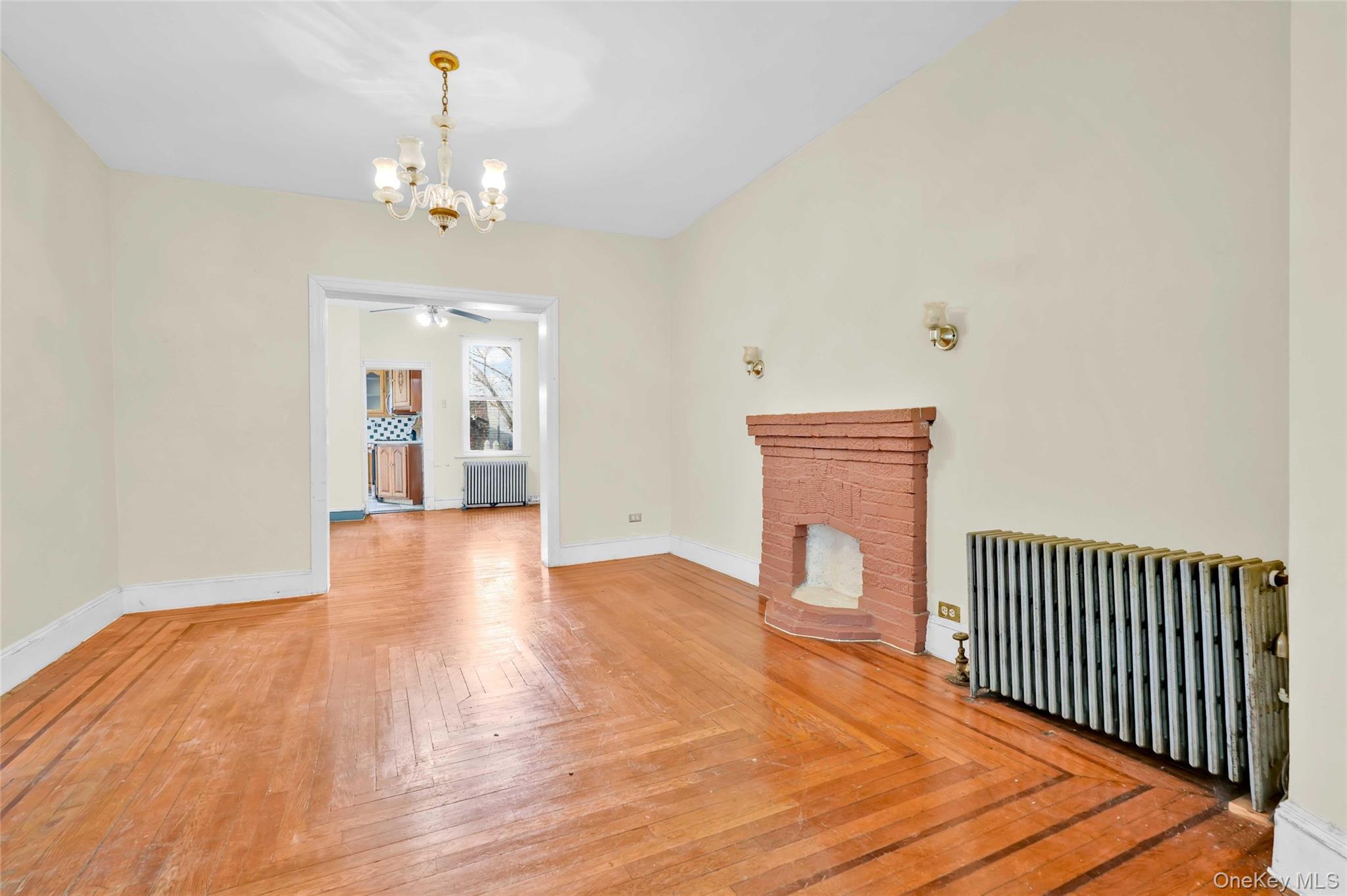 194 Crystal Street Brooklyn, NY 11208 - Photo 14 of 16 a view of an empty room with wooden floor and a window