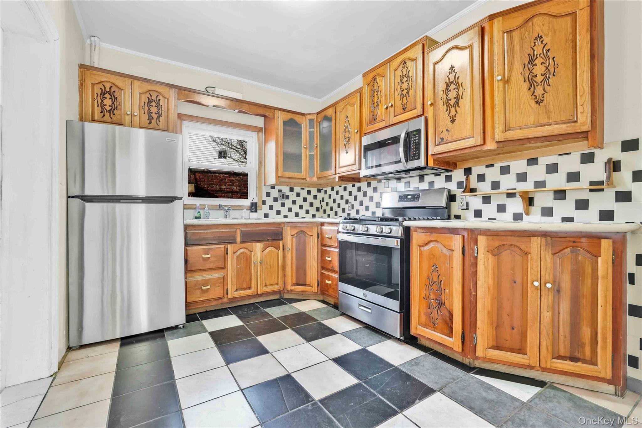 194 Crystal Street Brooklyn, NY 11208 - Photo 7 of 16 a kitchen with stainless steel appliances granite countertop a refrigerator and a stove top oven