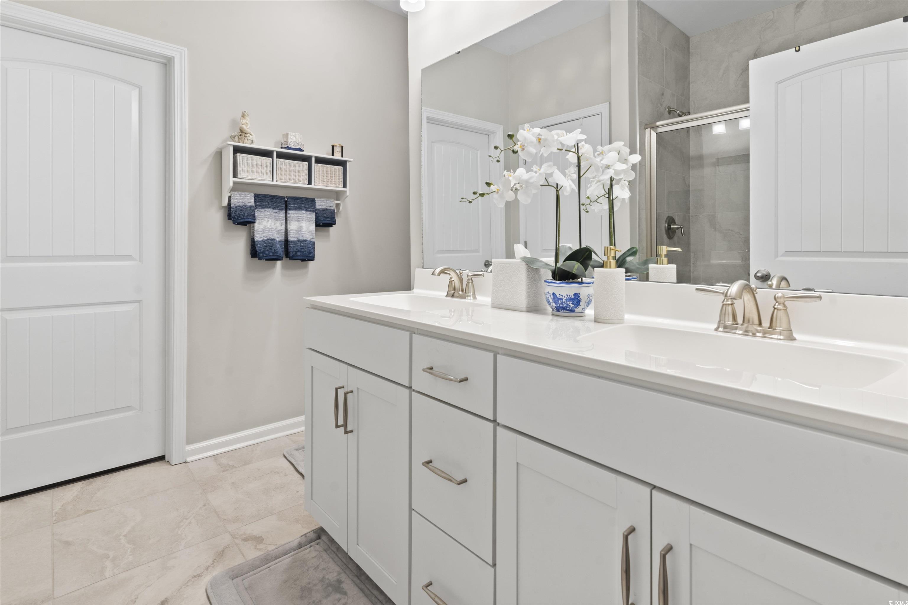 4027 Taranto Loop, Unit C Myrtle Beach, SC 29579 - Photo 17 of 36 Full bathroom with a stall shower, baseboards, and