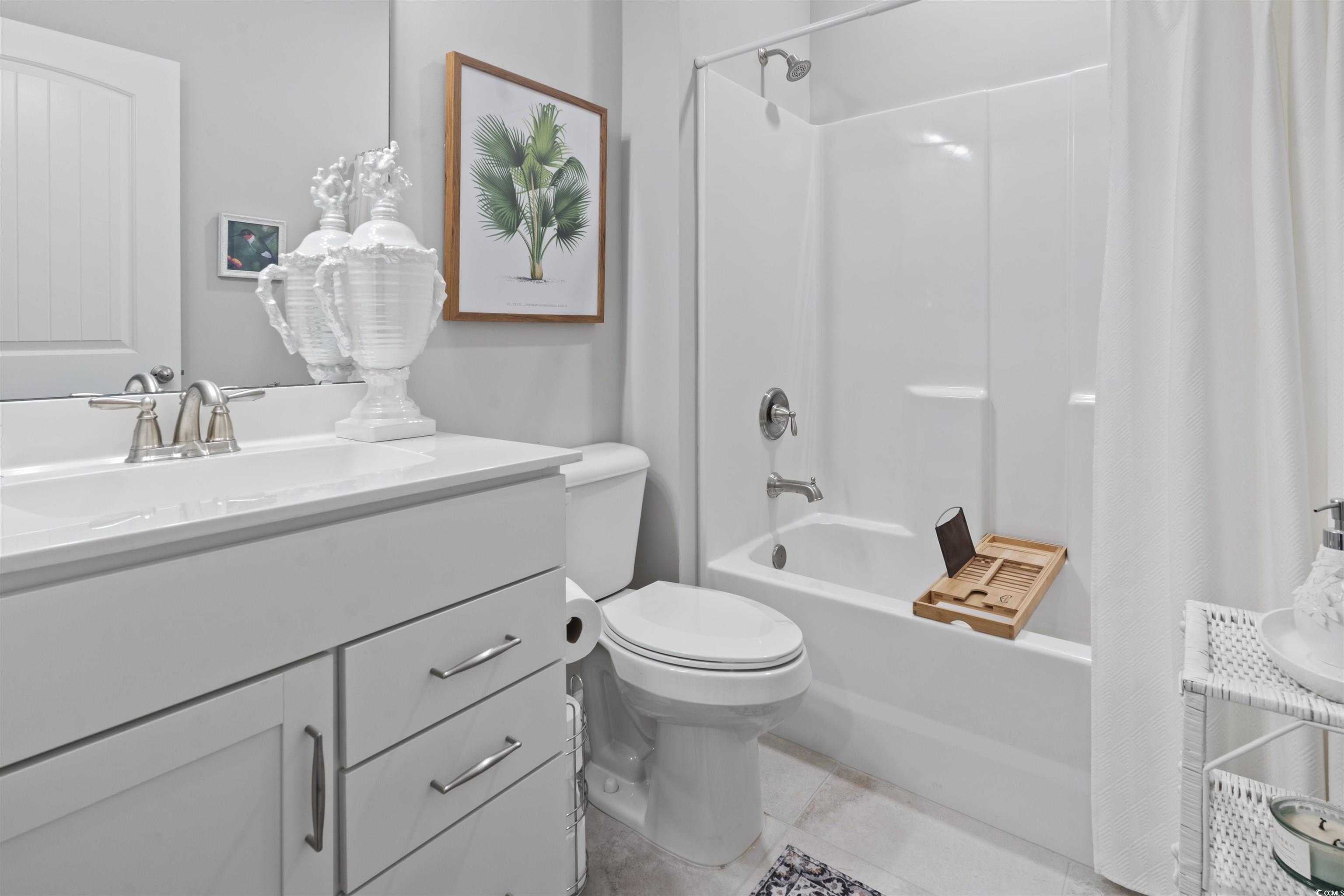 4027 Taranto Loop, Unit C Myrtle Beach, SC 29579 - Photo 21 of 36 Bathroom with shower / bath combo, toilet, vanity,