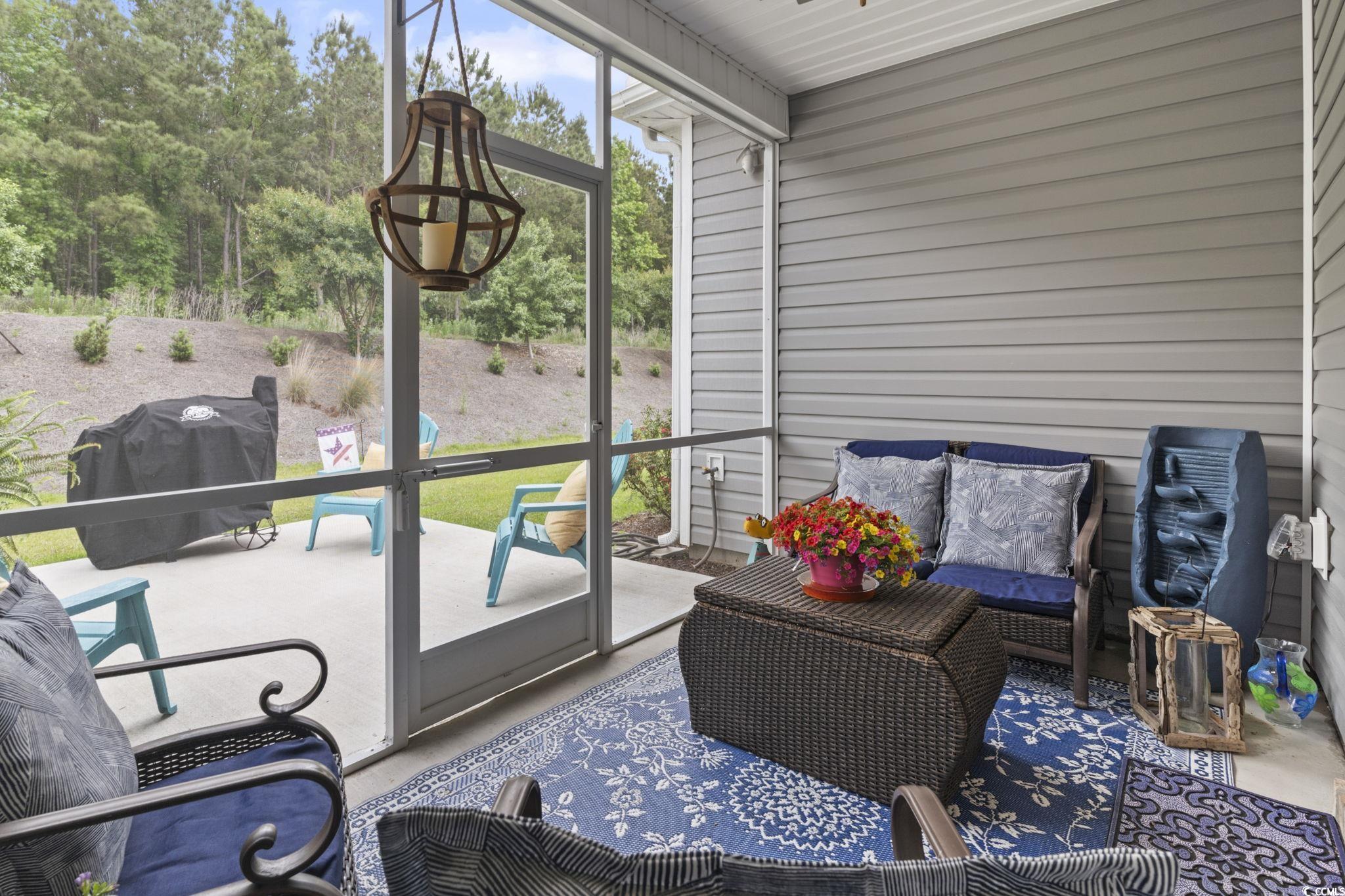 4027 Taranto Loop, Unit C Myrtle Beach, SC 29579 - Photo 23 of 36 Sunroom / solarium with plenty of natural light