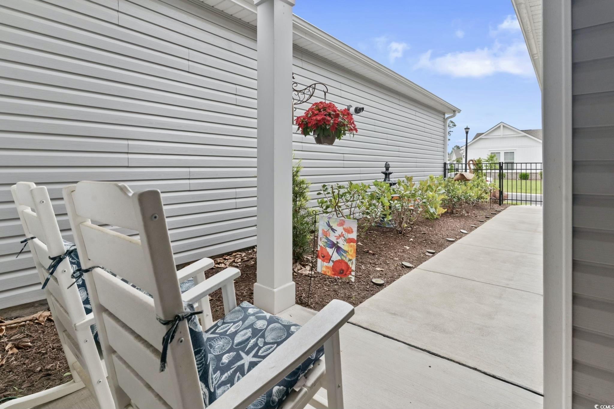 View of patio featuring fence