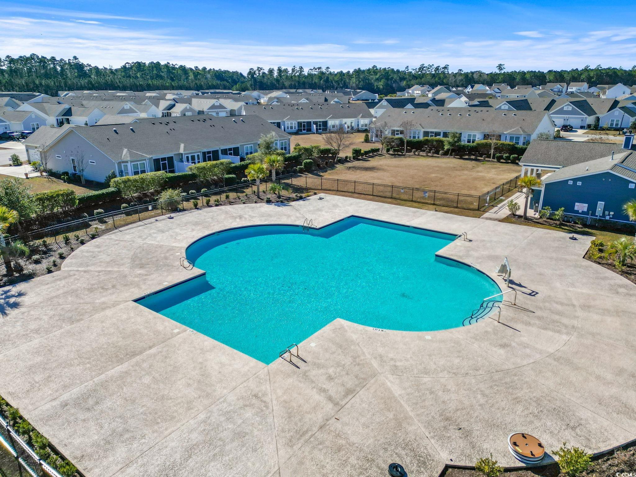 4027 Taranto Loop, Unit C Myrtle Beach, SC 29579 - Photo 31 of 36 Community pool featuring a residential view, fence