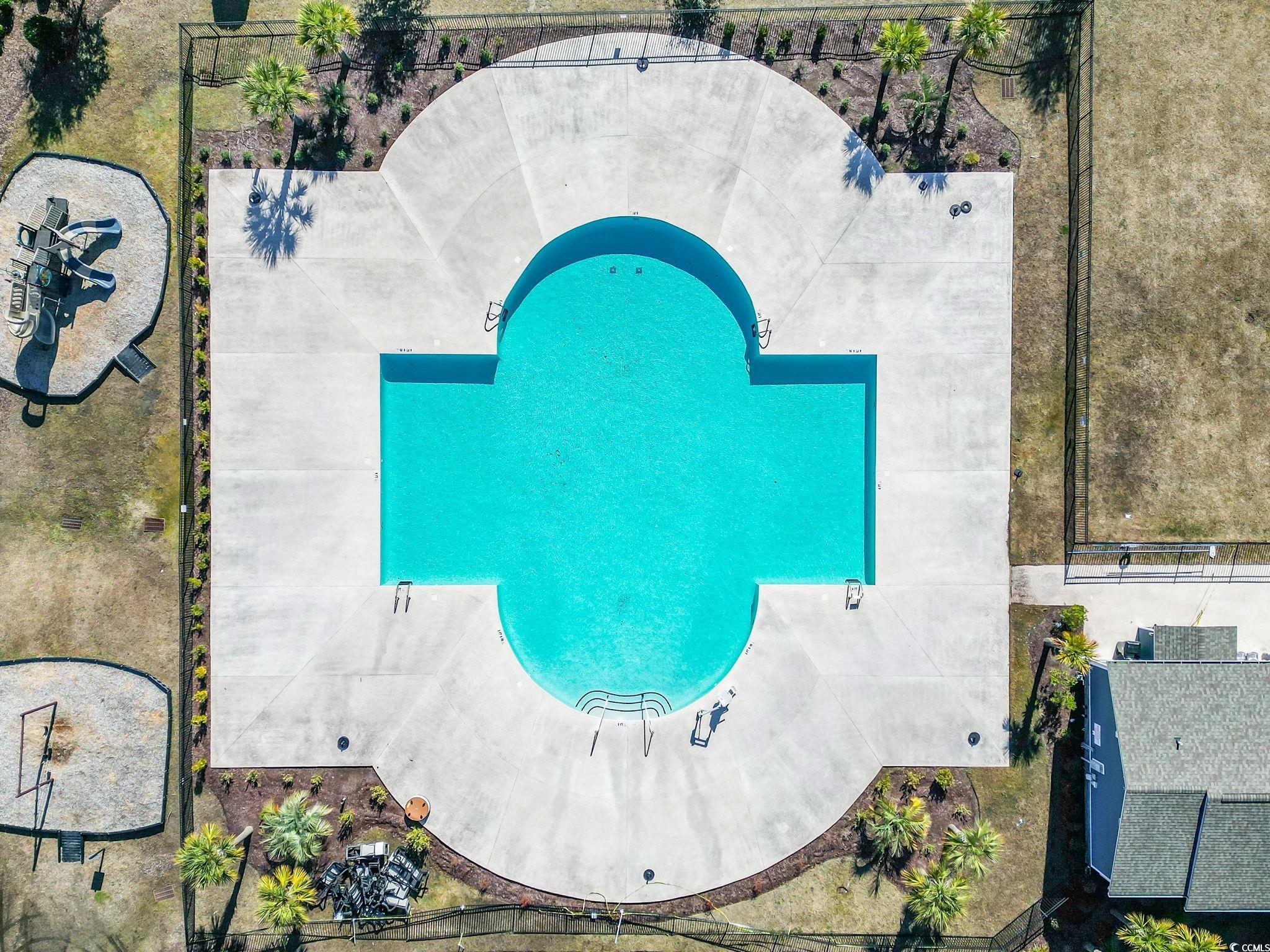 4027 Taranto Loop, Unit C Myrtle Beach, SC 29579 - Photo 32 of 36 Drone / aerial view of a pool area