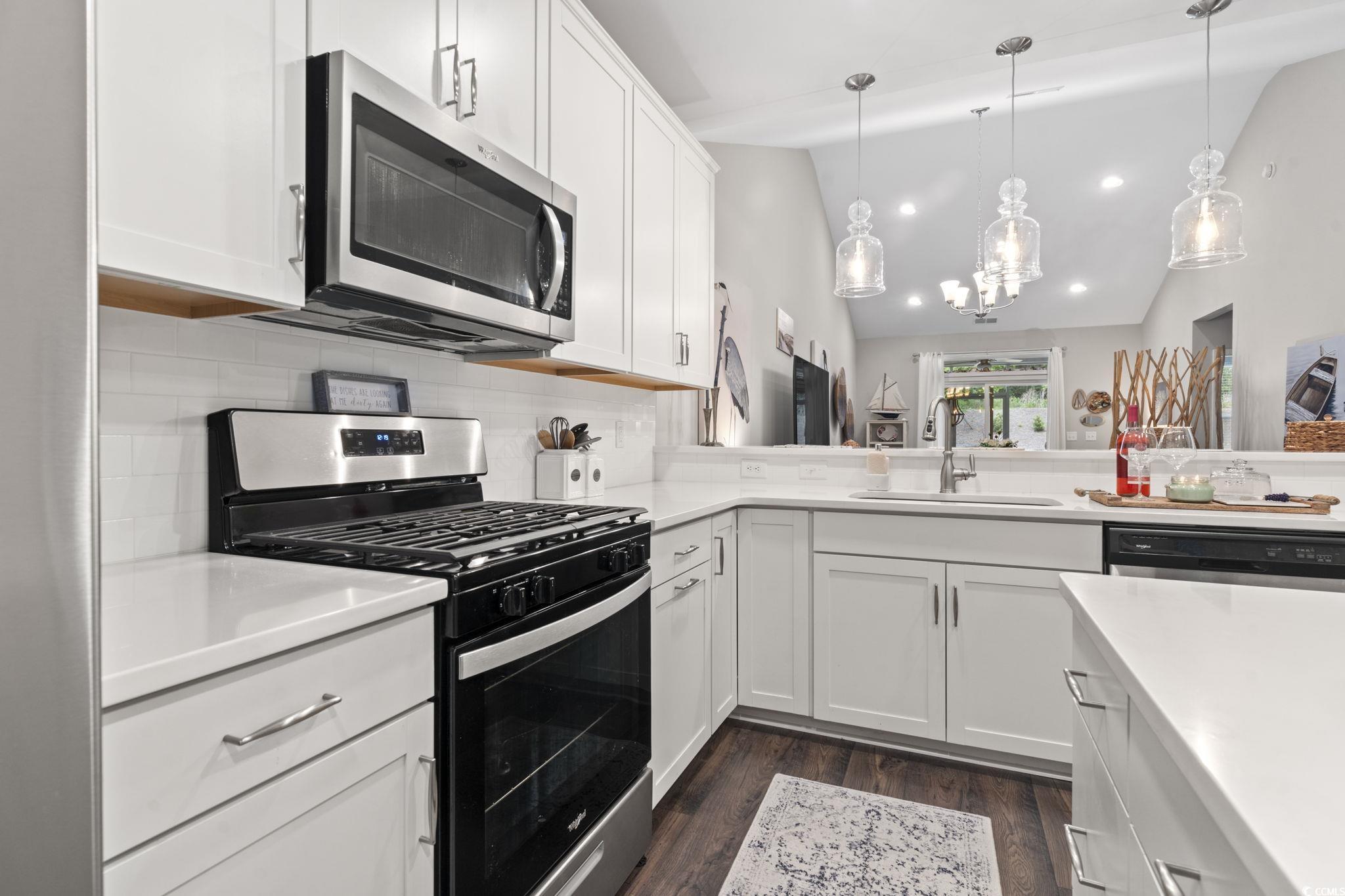 Kitchen featuring appliances with stainless steel