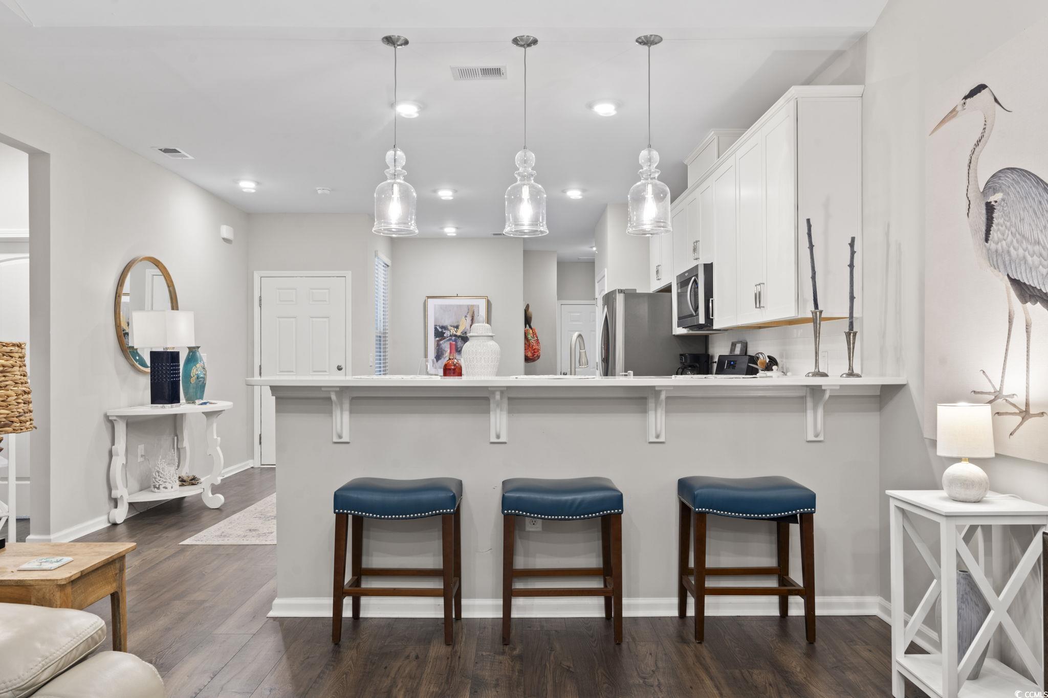 Kitchen featuring appliances with stainless steel