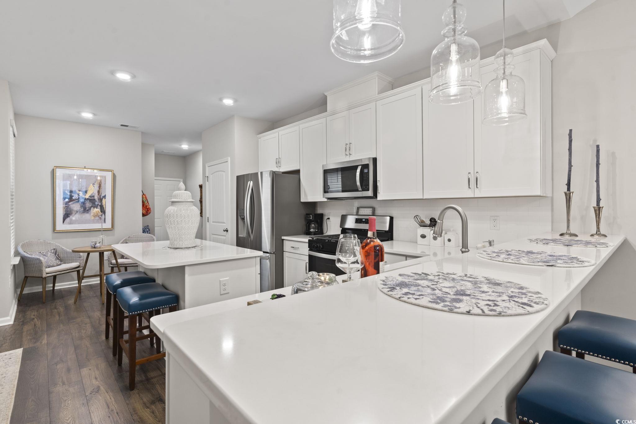 4027 Taranto Loop, Unit C Myrtle Beach, SC 29579 - Photo 8 of 36 Kitchen with appliances with stainless steel finis