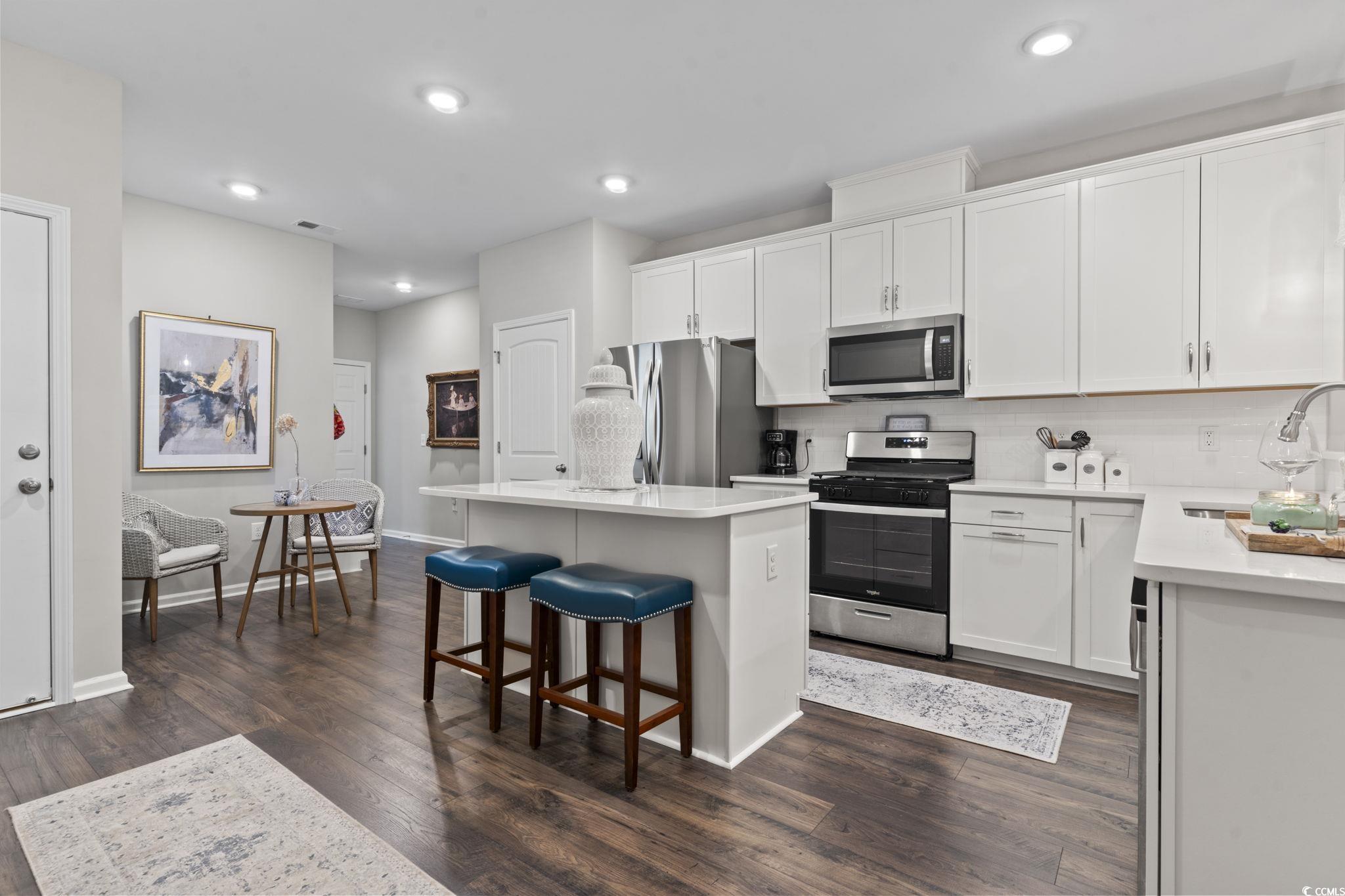 4027 Taranto Loop, Unit C Myrtle Beach, SC 29579 - Photo 9 of 36 Kitchen with stainless steel appliances, a sink, a