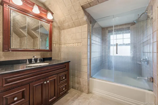 a bathroom with a sink a bathtub and a shower