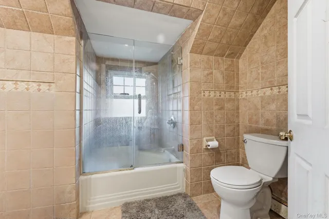 a bathroom with a bathtub and a toilet
