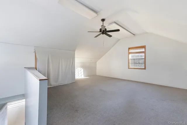 a view of a big room with carpet