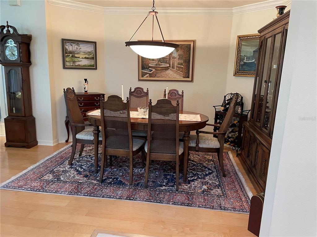 5000 Ibis Way, Unit 101 Venice, FL 34292 - Photo 11 of 39 a view of a dining room with furniture