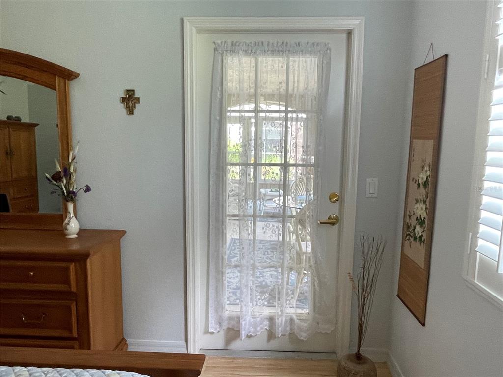 5000 Ibis Way, Unit 101 Venice, FL 34292 - Photo 13 of 39 a view of front door with wooden floor