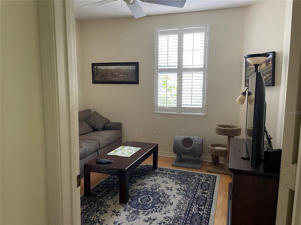 5000 Ibis Way, Unit 101 Venice, FL 34292 - Photo 16 of 39 a living room with furniture a rug and a window