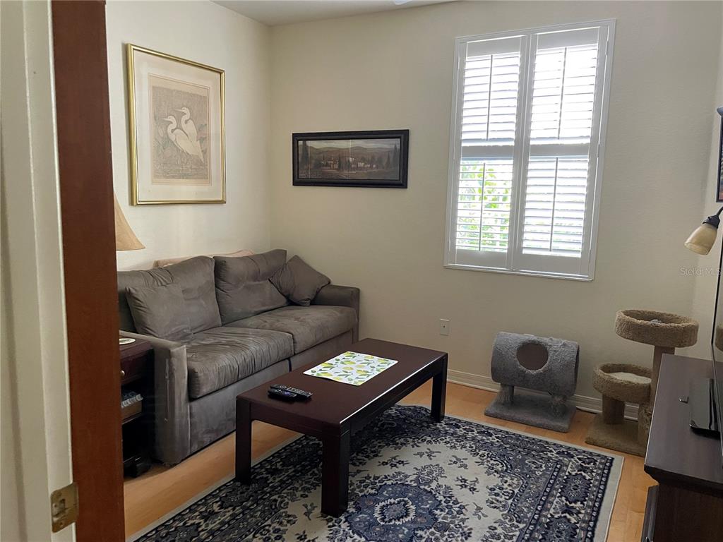 5000 Ibis Way, Unit 101 Venice, FL 34292 - Photo 17 of 39 a living room with furniture and a window