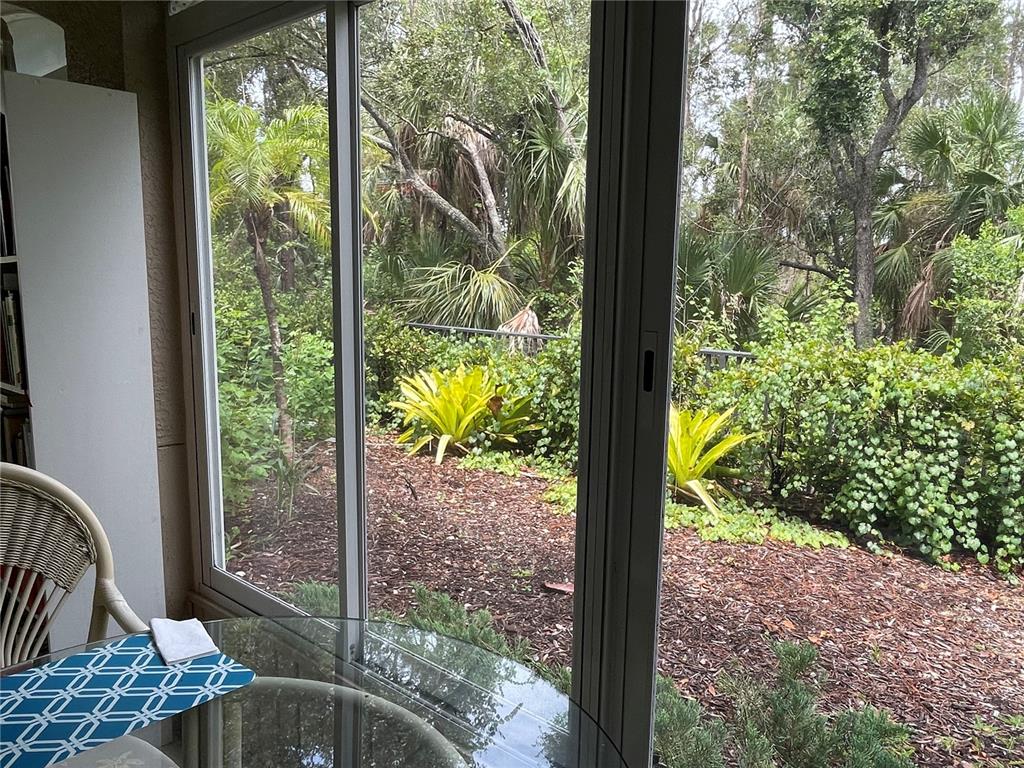 5000 Ibis Way, Unit 101 Venice, FL 34292 - Photo 18 of 39 a view of a porch with backyard