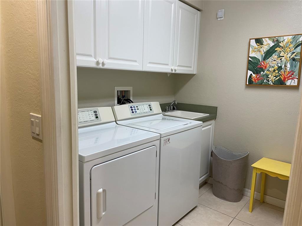 5000 Ibis Way, Unit 101 Venice, FL 34292 - Photo 21 of 39 a utility room with dryer and washer