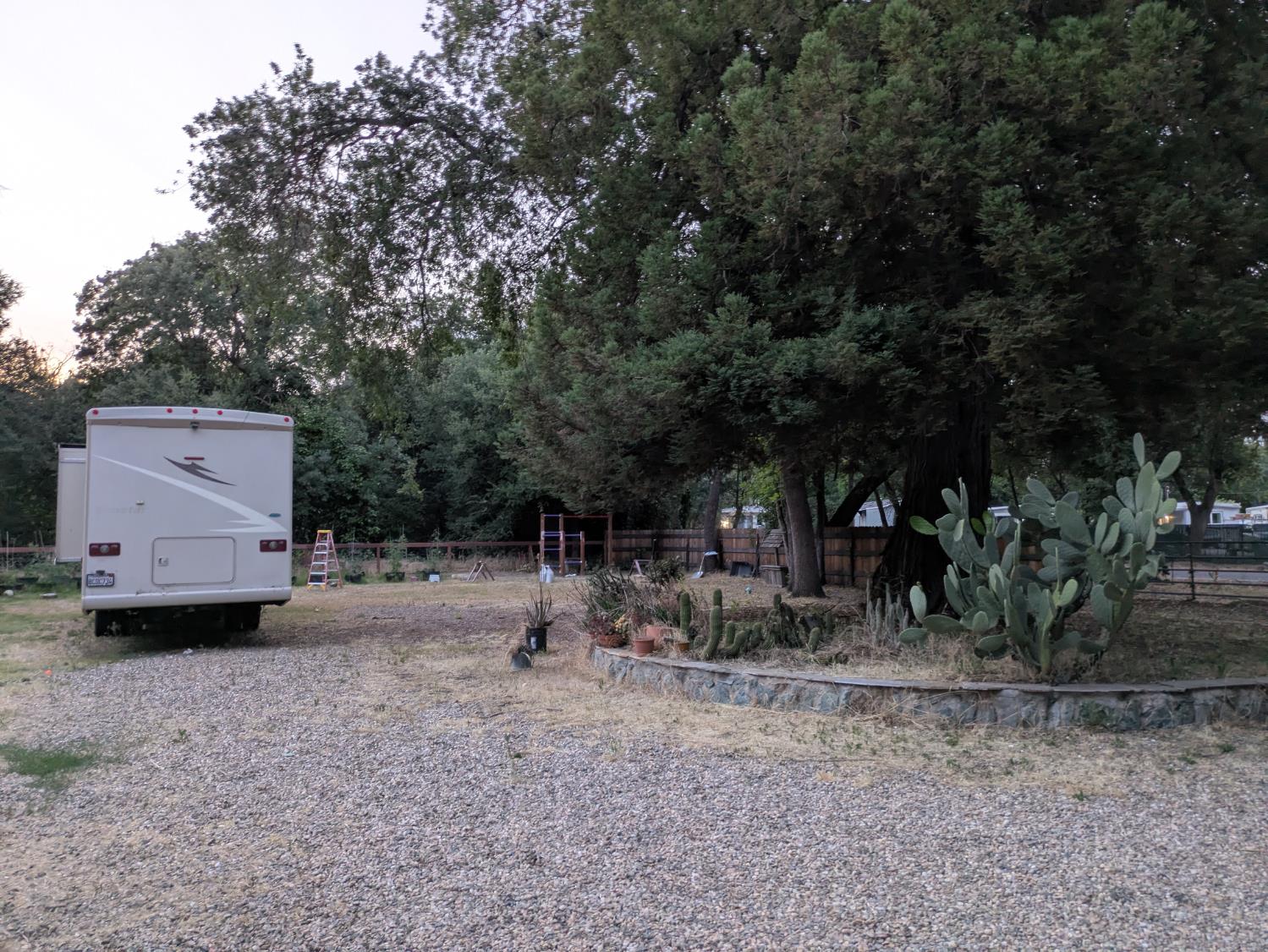 25931 Thornton Road Thornton, CA 95686 - Photo 25 of 31 a backyard of a house with barbeque oven table and chairs