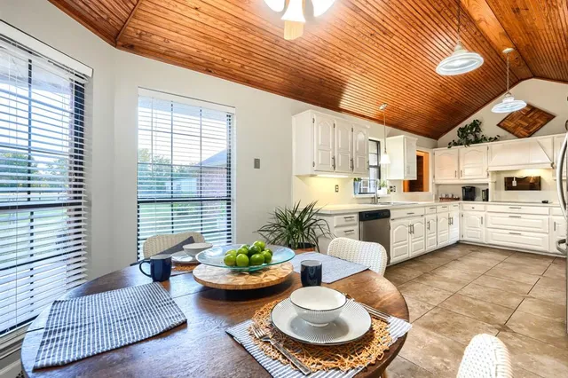 a kitchen with stainless steel appliances a sink and a cabinets
