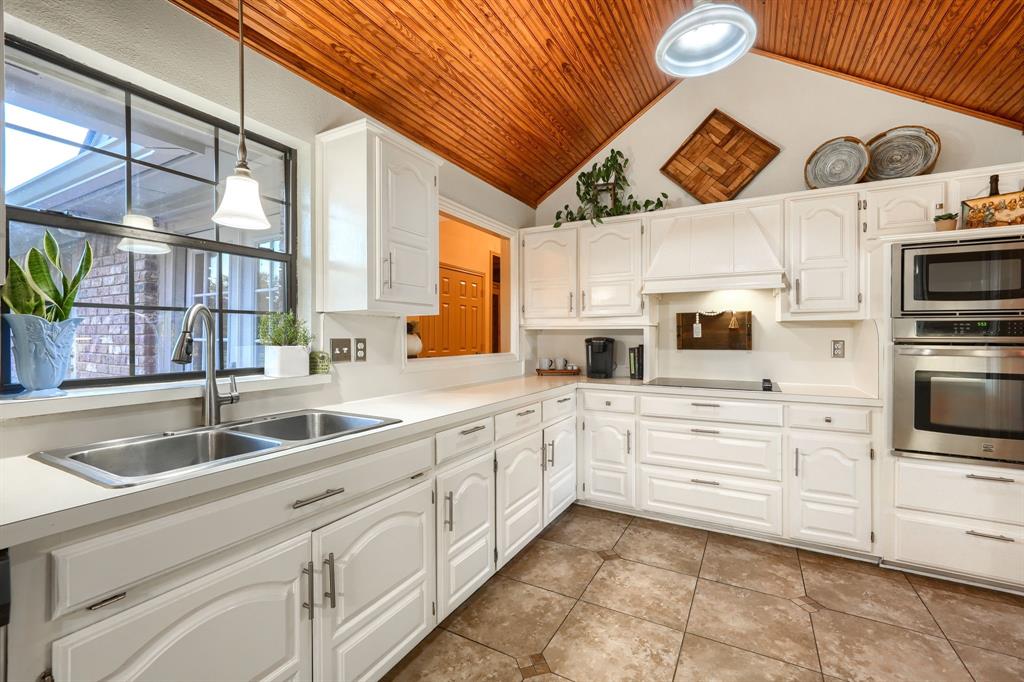 2592 Meadow Way Kaufman, TX 75142 - Photo 12 of 40 a kitchen with stainless steel appliances a sink and a cabinets