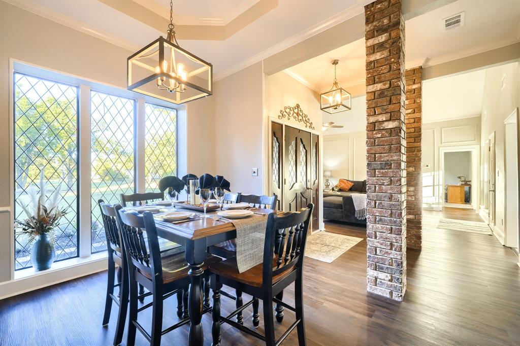 2592 Meadow Way Kaufman, TX 75142 - Photo 14 of 40 a view of a dining room with furniture window and wooden floor