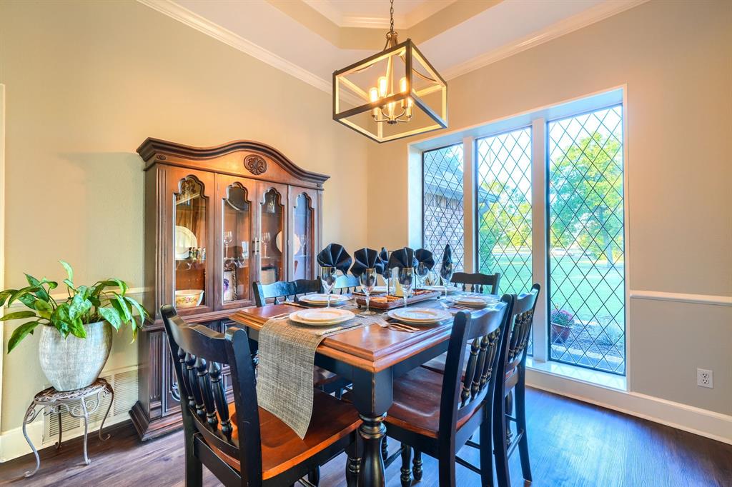 2592 Meadow Way Kaufman, TX 75142 - Photo 15 of 40 a view of a dining room and livingroom with lots of furniture wooden floor and a chandelier