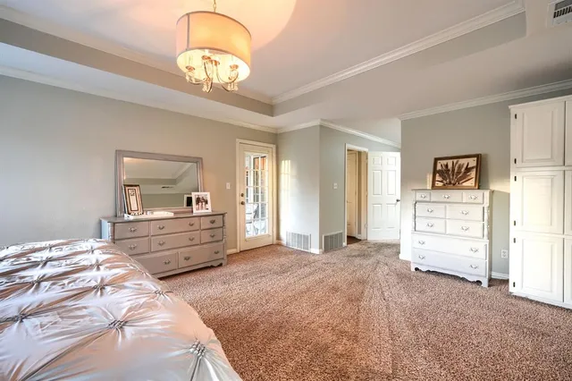 a large bathroom with a large tub and sink