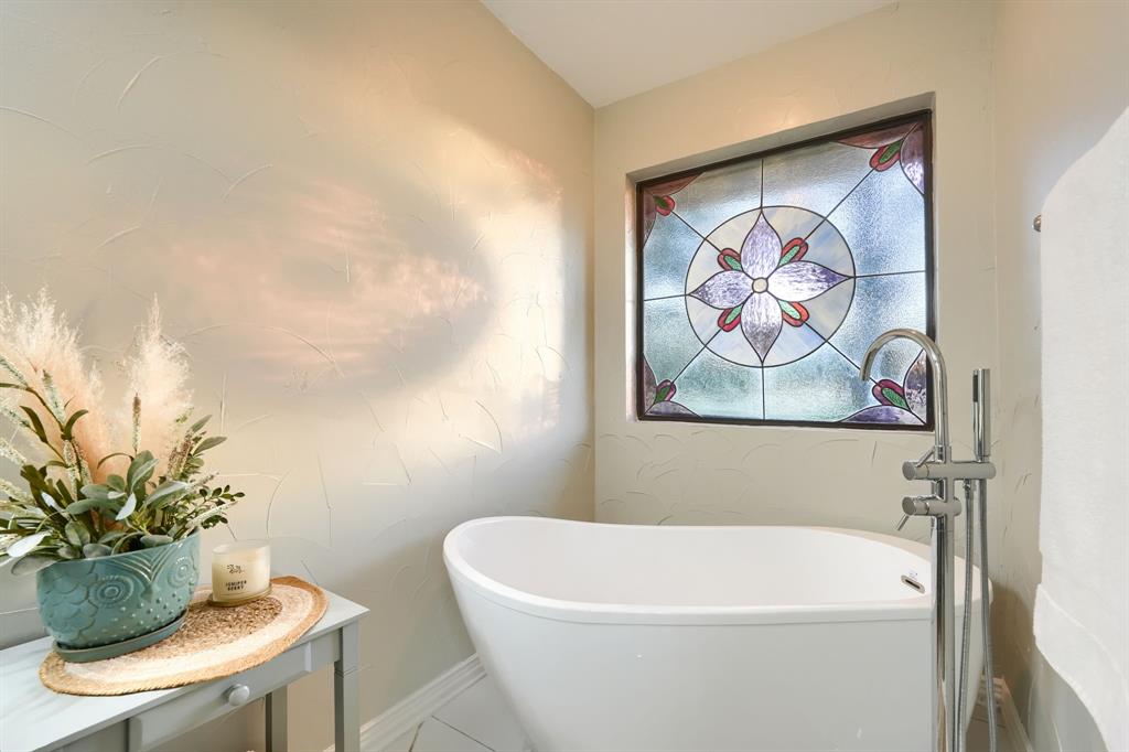 2592 Meadow Way Kaufman, TX 75142 - Photo 21 of 40 a white bath tub sitting next to a white wall