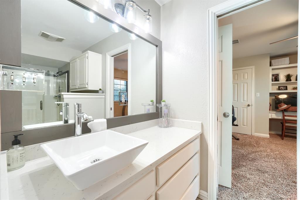 2592 Meadow Way Kaufman, TX 75142 - Photo 27 of 40 a room with kitchen island a sink table and chairs