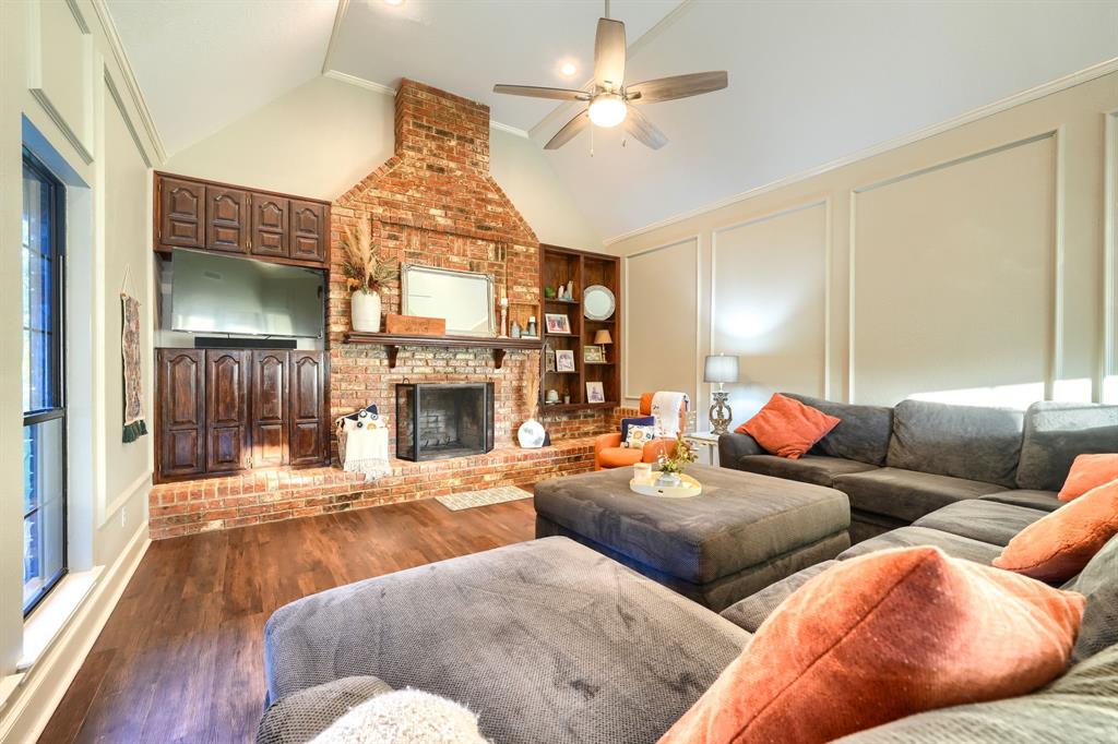 2592 Meadow Way Kaufman, TX 75142 - Photo 7 of 40 a living room with furniture chandelier and a fireplace