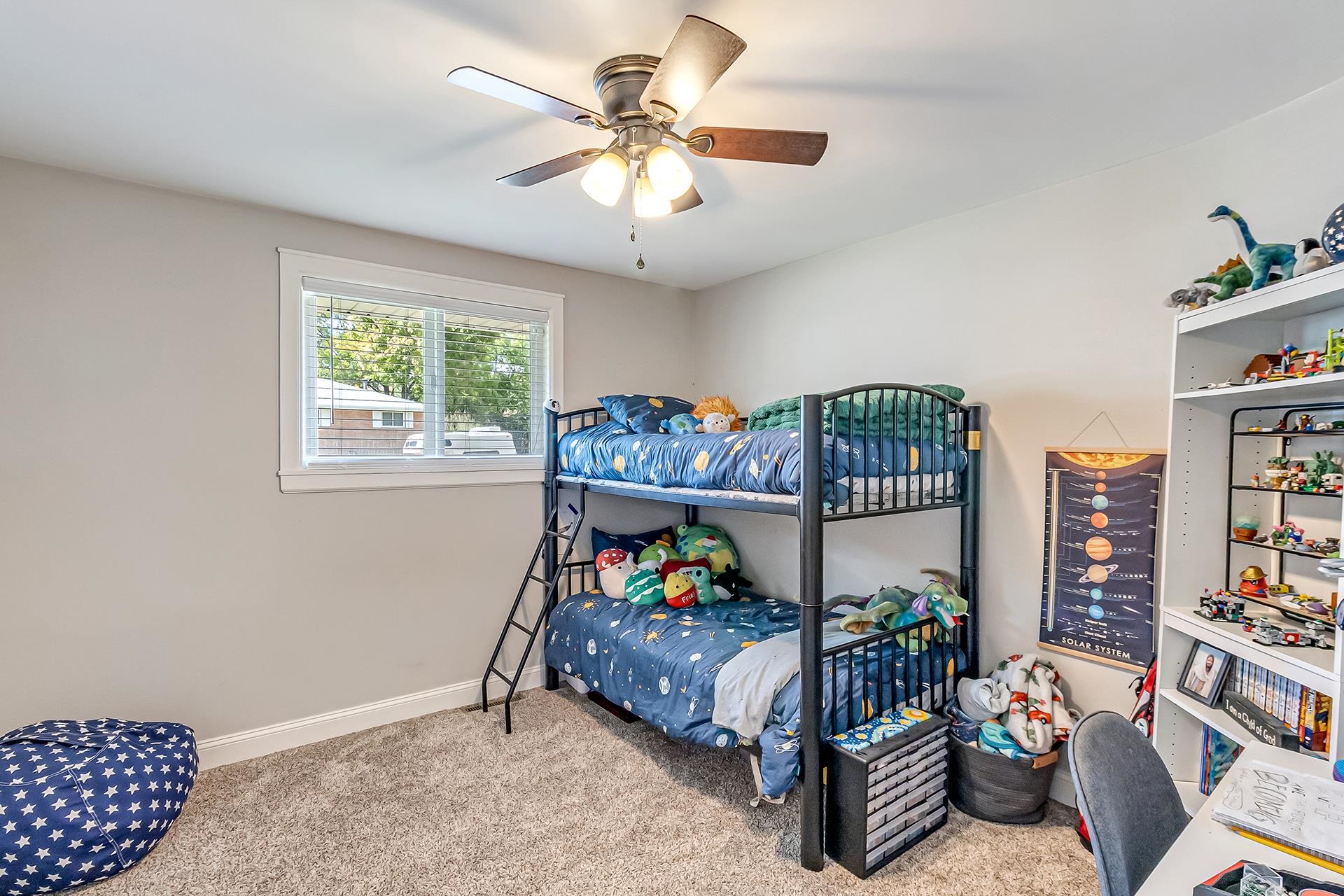 2118 Saguaro Road Grand Junction, CO 81507 - Photo 15 of 42 a bed room with furniture and a chandelier