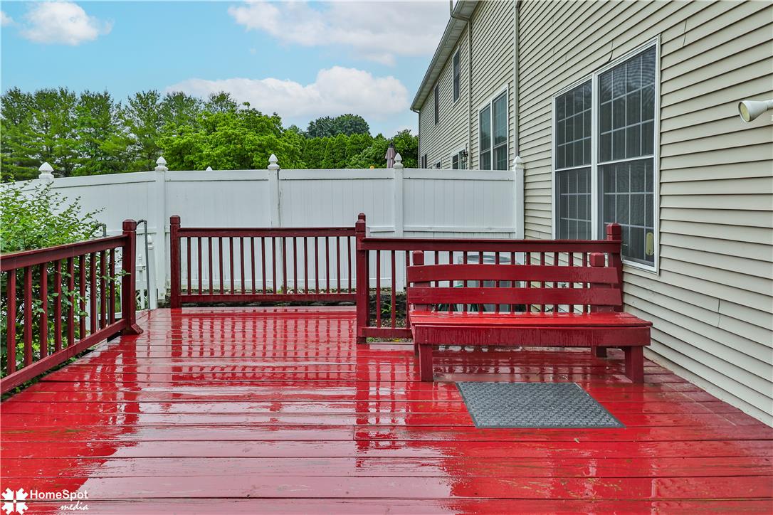 507 Howertown Road Northampton, PA 18067 - Photo 38 of 46 A vibrant red deck and bench offer a refreshing outdoor retreat, complemented by a pristine white fence.
