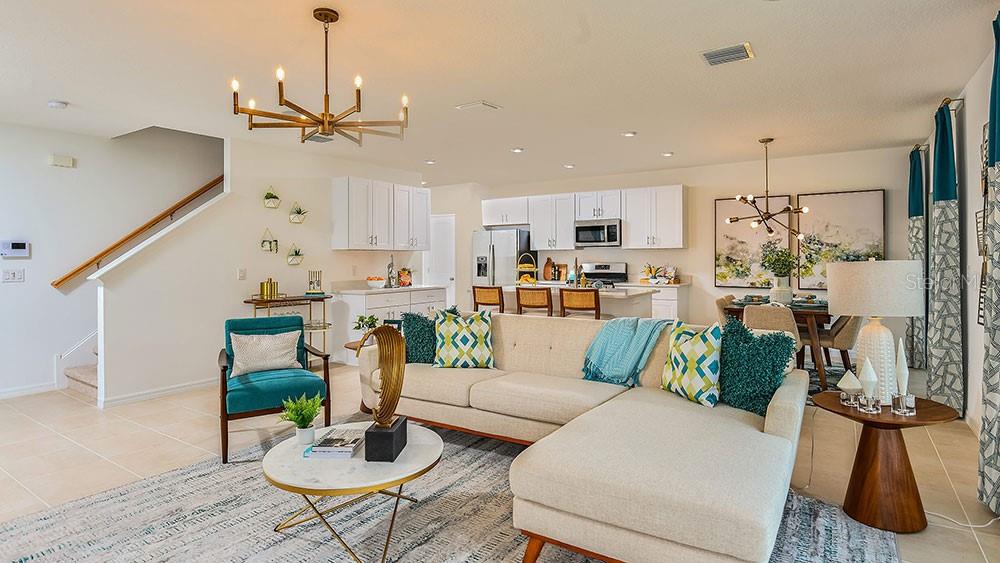 13811 Shellmore Avenue Palmetto, FL 34221 - Photo 12 of 17 a living room with furniture and kitchen view