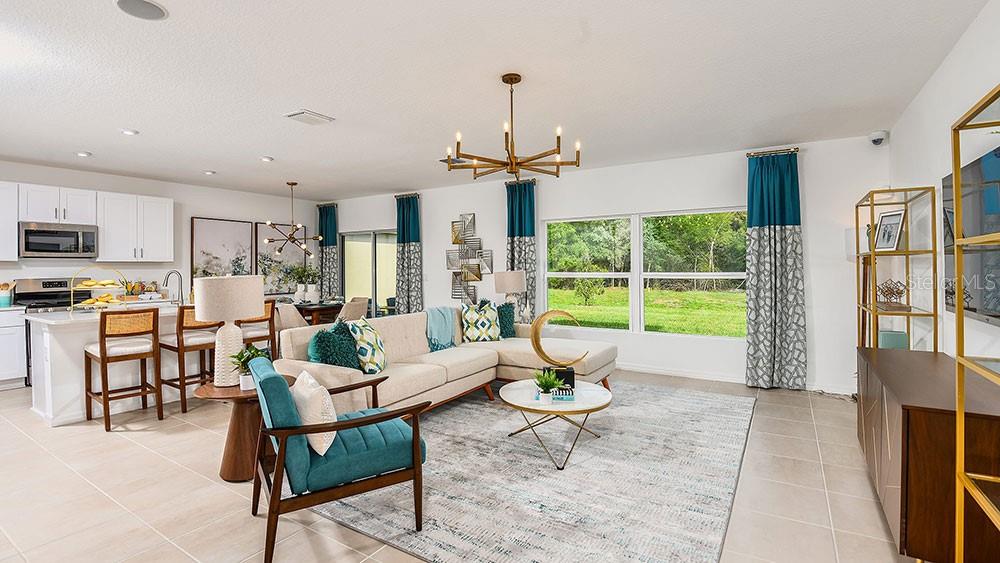 13811 Shellmore Avenue Palmetto, FL 34221 - Photo 13 of 17 a living room with furniture and a table