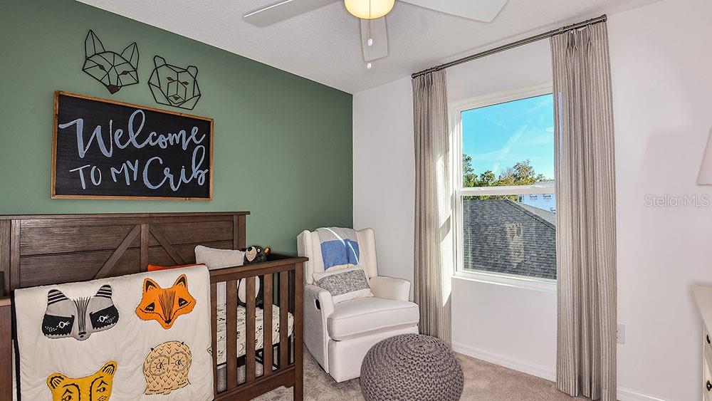 13811 Shellmore Avenue Palmetto, FL 34221 - Photo 7 of 17 a bedroom with a bed and a window