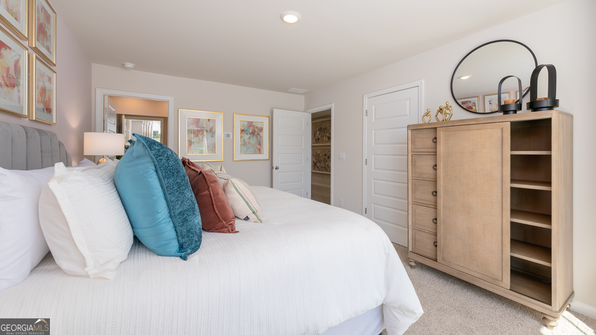 2082 Moss Hill Road Stone Mountain, GA 30088 - Photo 27 of 38 a spacious bedroom with bed and a window