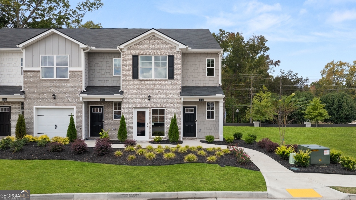 2082 Moss Hill Road Stone Mountain, GA 30088 - Photo 5 of 38 a front view of a house with a yard