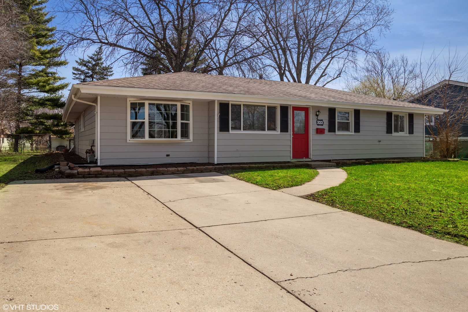 323 Springinsguth Road Schaumburg, IL 60193 - Photo 1 of 14 a front view of a house with a garden