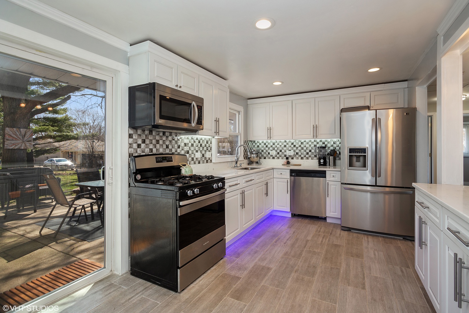 323 Springinsguth Road Schaumburg, IL 60193 - Photo 4 of 14 a kitchen with stainless steel appliances granite countertop a refrigerator stove and microwave
